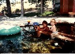 Family playing in the kid's pool - 